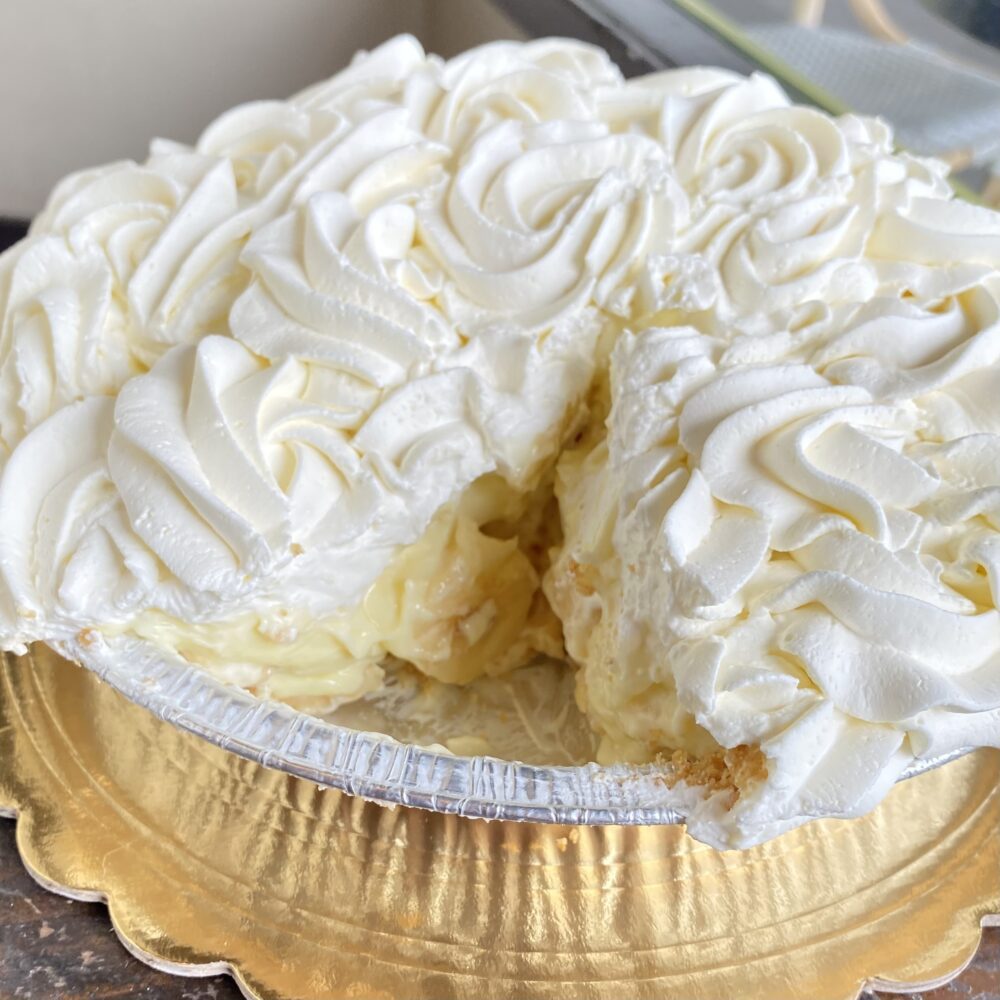 Detail of a Banana Cream Pie with a slice.