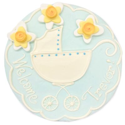 Top view of Baby Carriage decoration on a round cake frosted in blue buttercream.