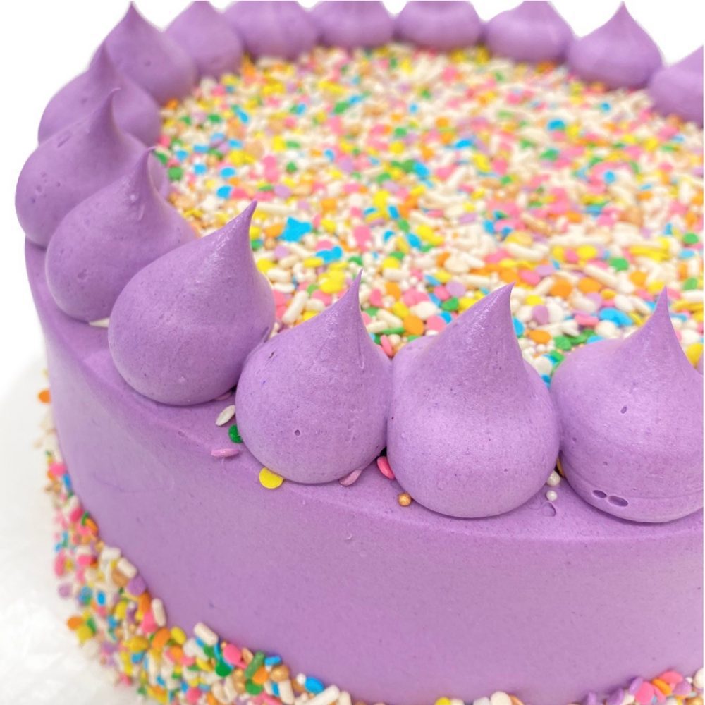 Celebration decoration in purple buttercream.