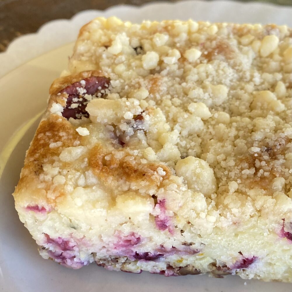 Detail of cranberry orange coffee cake on a plate.