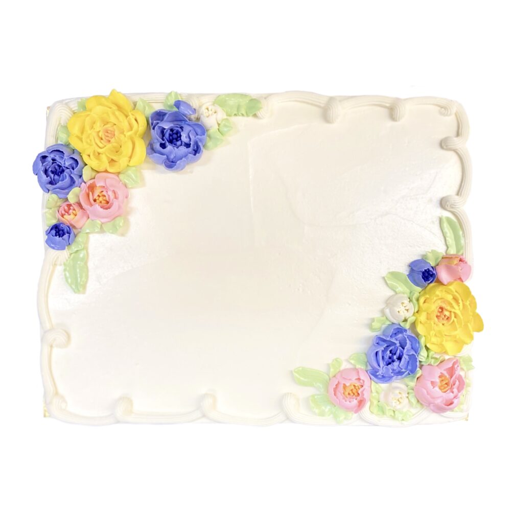 Top view of sheet cake with Floral Bouquet decoration frosted in white buttercream.