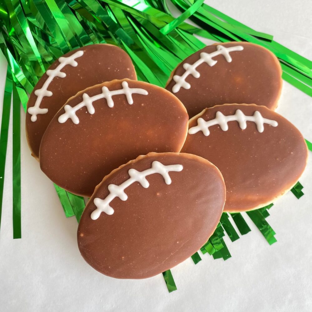 Football-shaped glazed sugar cookies.