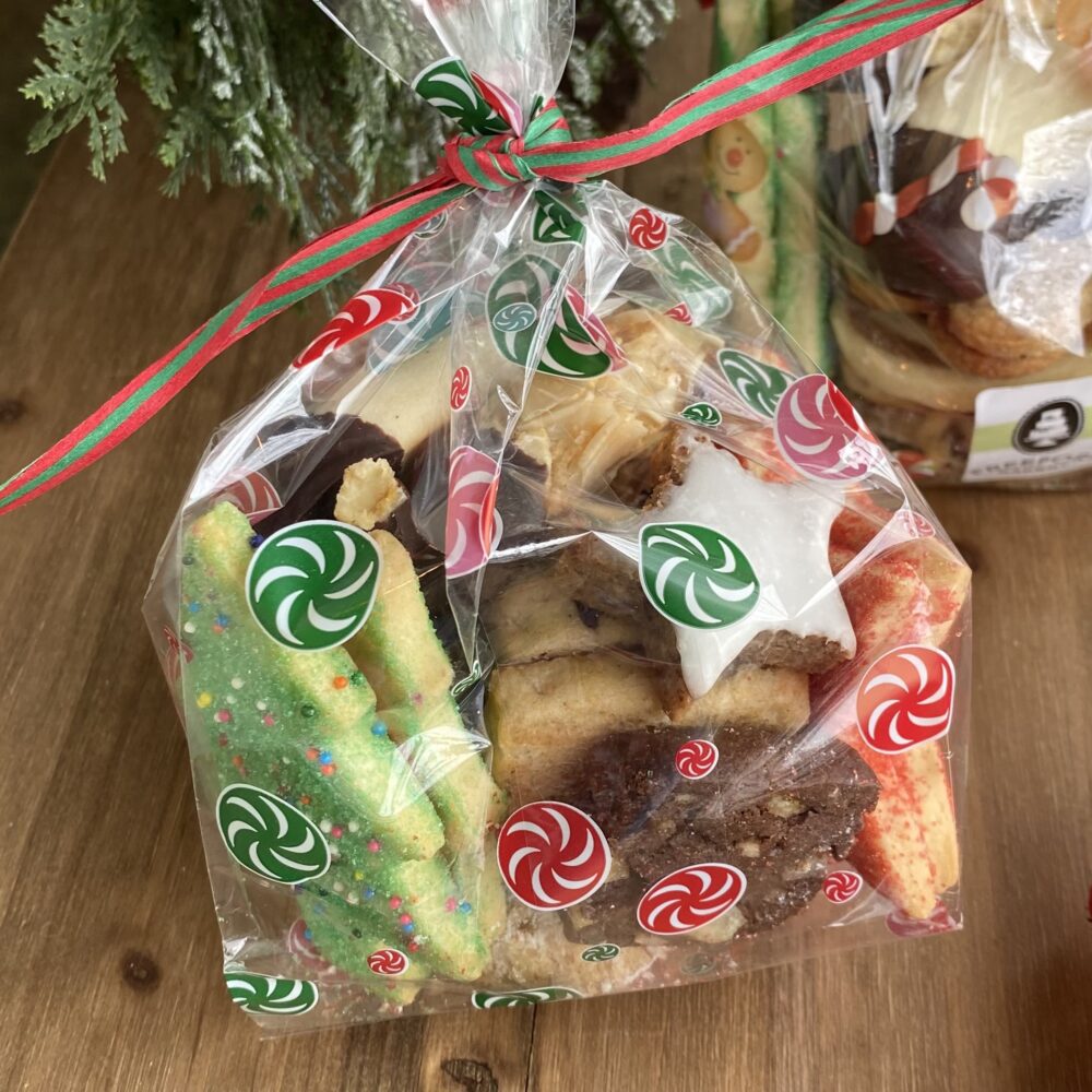 Detail of an old fashioned cookie assortment in gift bag tied with festive ribbon.