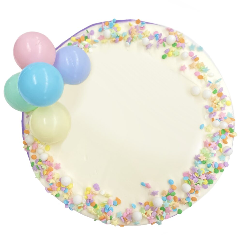 Top view of Pastel Balloons decoration on round cake frosted in white buttercream.