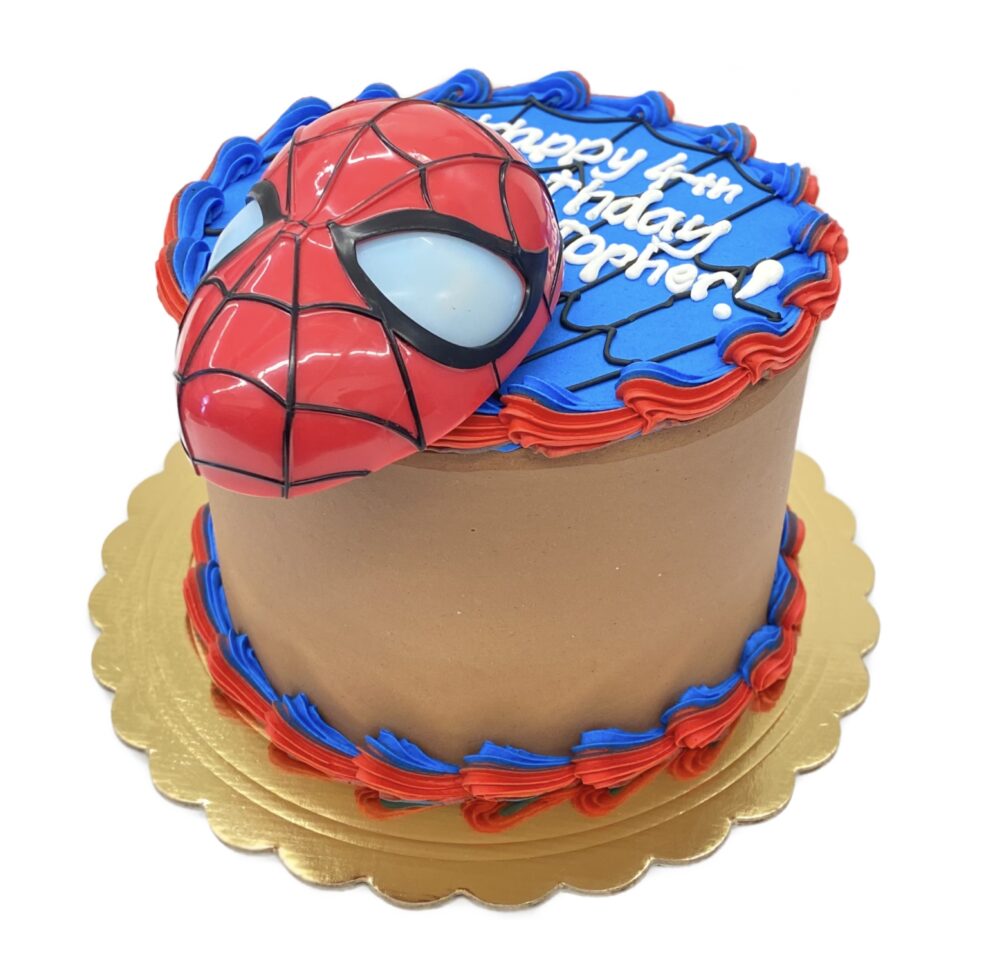 Side view of Spider-Man Cake frosted in chocolate buttercream.